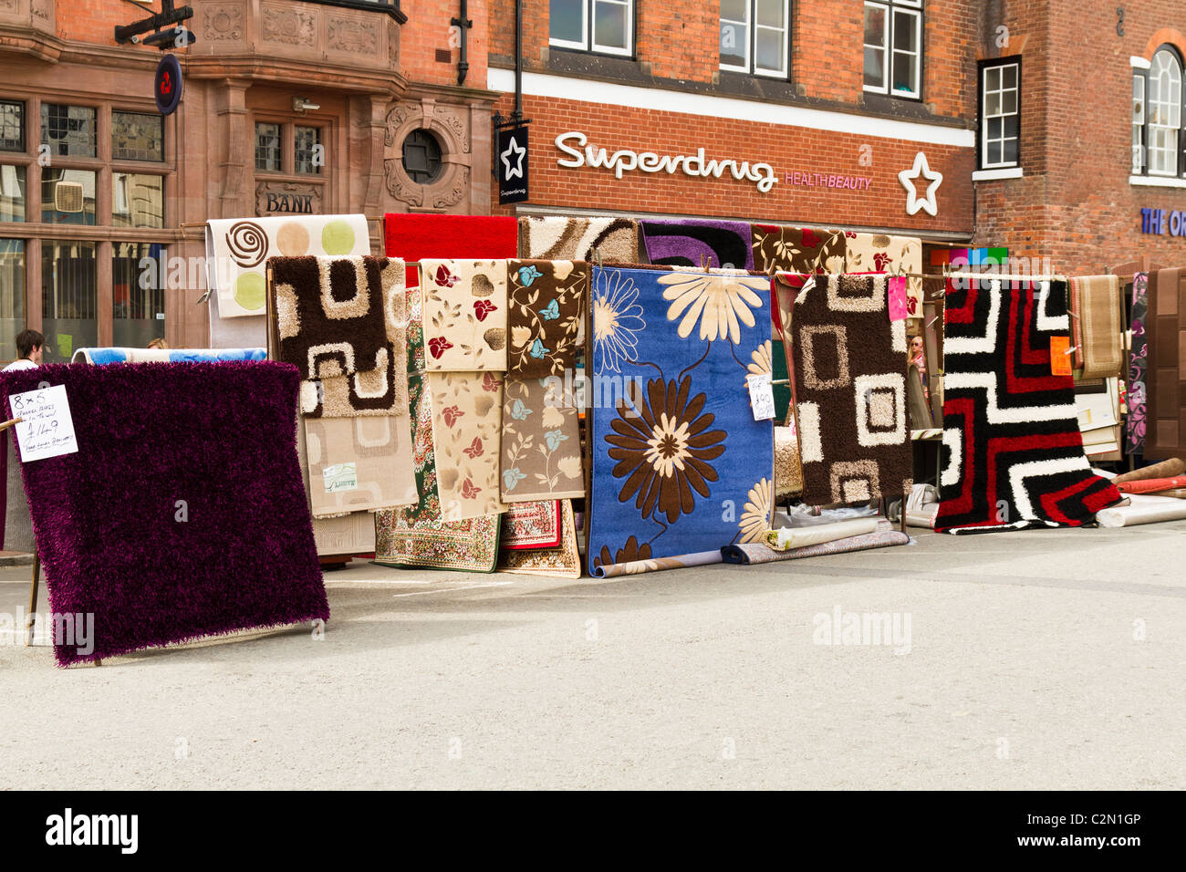 A market stall selling carpets Stock Photo Alamy
