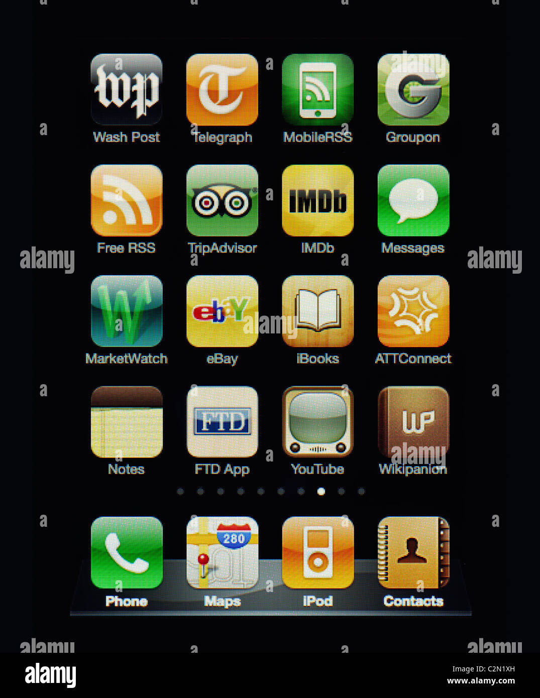 Image of the iphone touch screen. Display shows a collection of useful apps with orange and green color scheme. Stock Photo