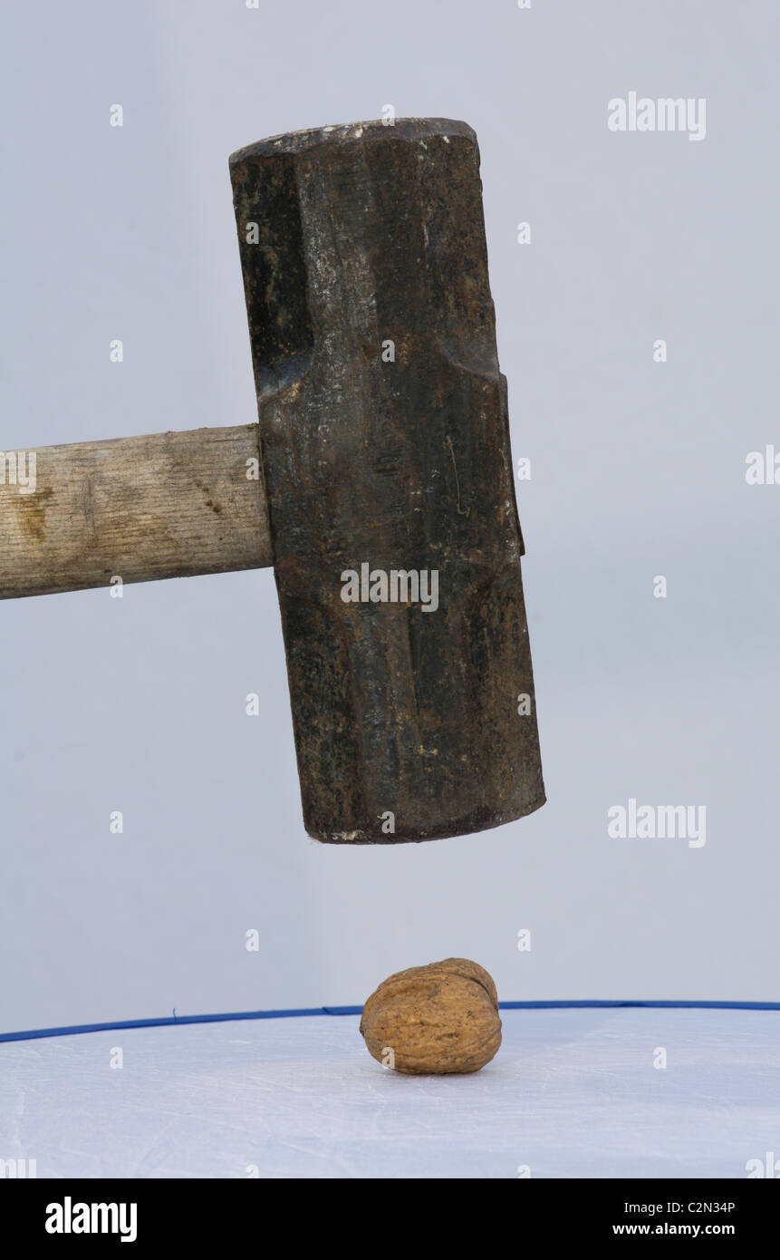 You do not use a sledgehammer to crack a nut hires stock photography