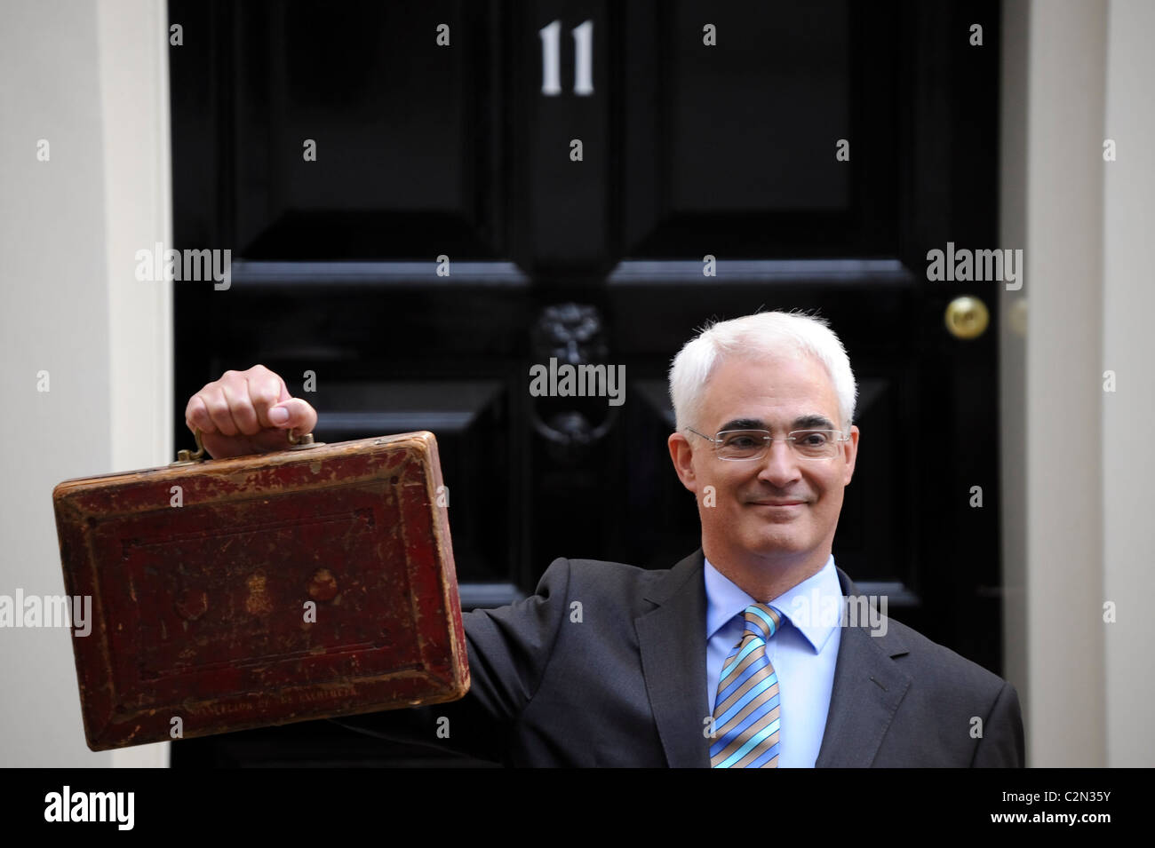 Former Chancellor of the Exchequer, the Right Hon Alistair Darling MP, leaves Number 11 Downing street with the 2009 Budget. Stock Photo