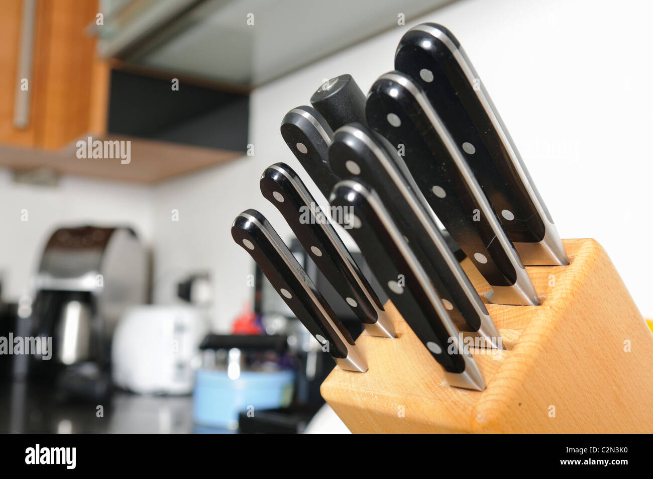 Set of quality Sabatier cooks knives in a modern kitchen Stock Photo