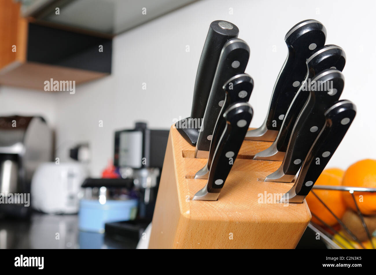 Set of quality Sabatier cooks knives in a modern kitchen Stock Photo