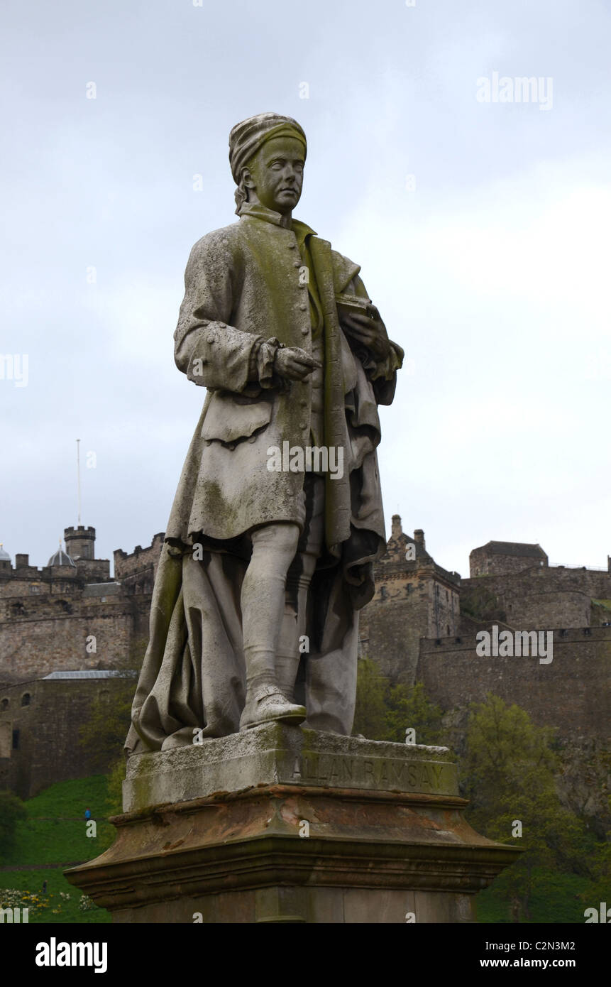 The statue of Allan Ramsay (1686-1758), sculpted by John Steell, stands in Princes Street Garden with Edinburgh Castle behind. Stock Photo