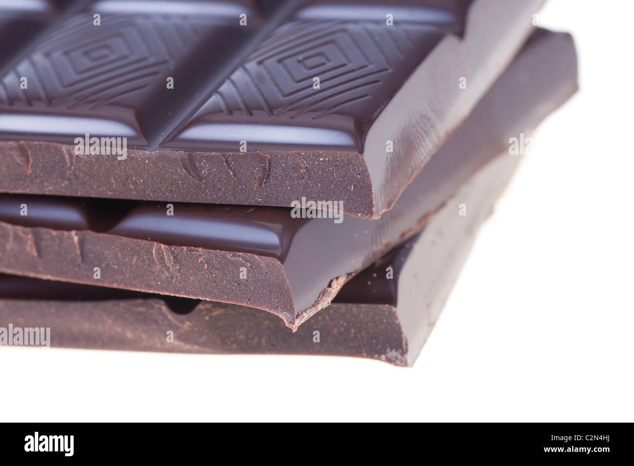 Stack of rich dark chocolate on a white background Stock Photo - Alamy