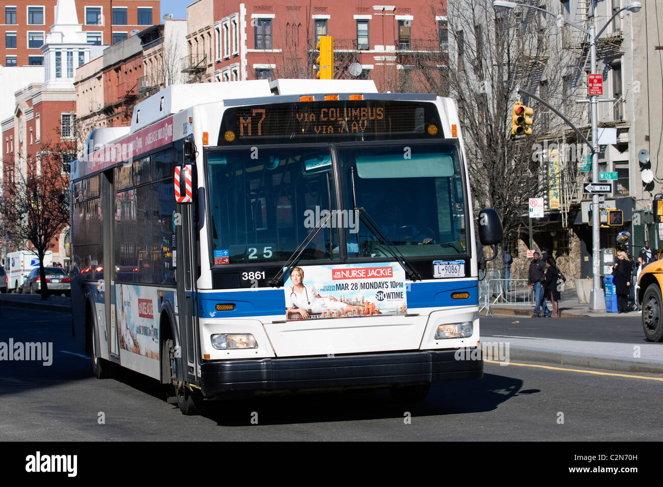 MTA Bus M7 driving South on Lenox Ave in Harlem, New York City. Stock Photo