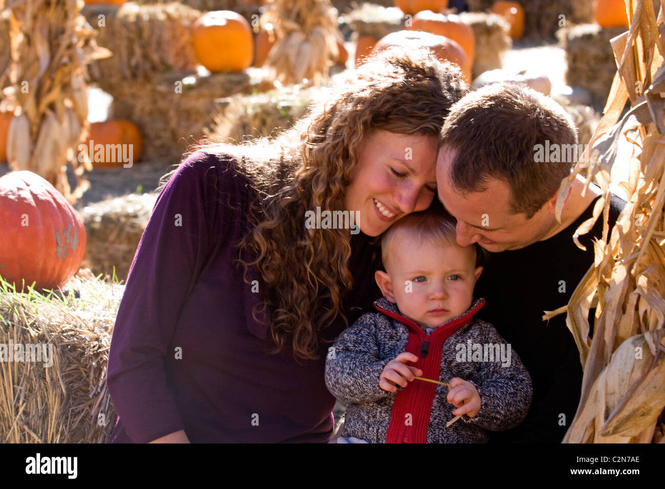 A family enjoying itself at a pumpkin patch. Stock Photo