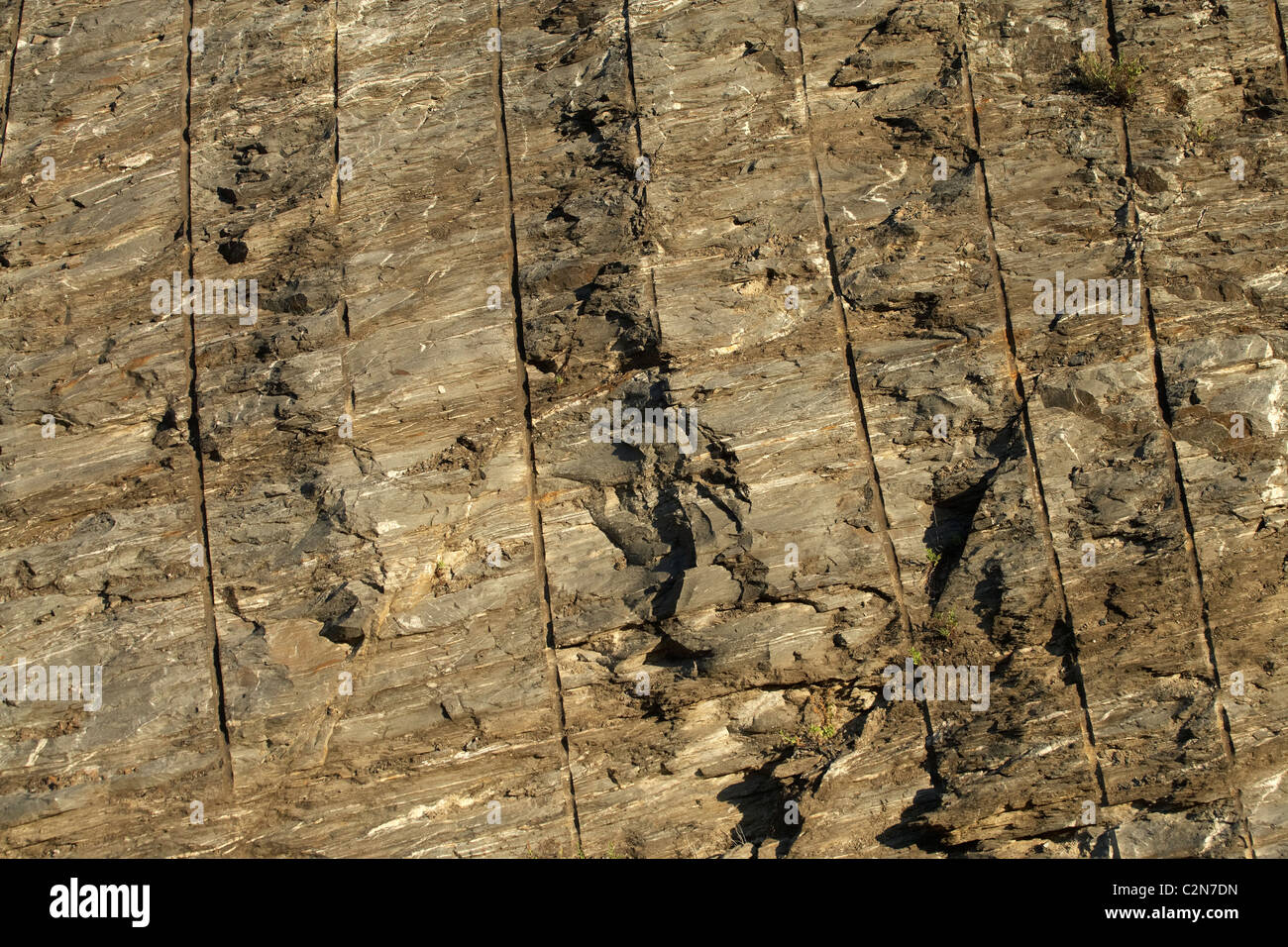 Drilled rock cutting beside road, Cromwell Gorge, Central Otago, South Island, New Zealand Stock Photo