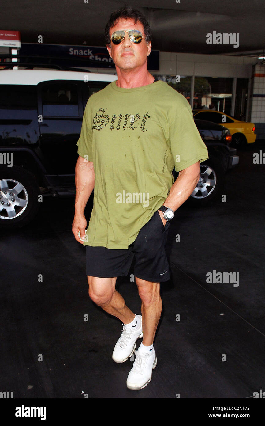 Sylvester Stallone fills up his Ferrari with gas at a 76 gas station in