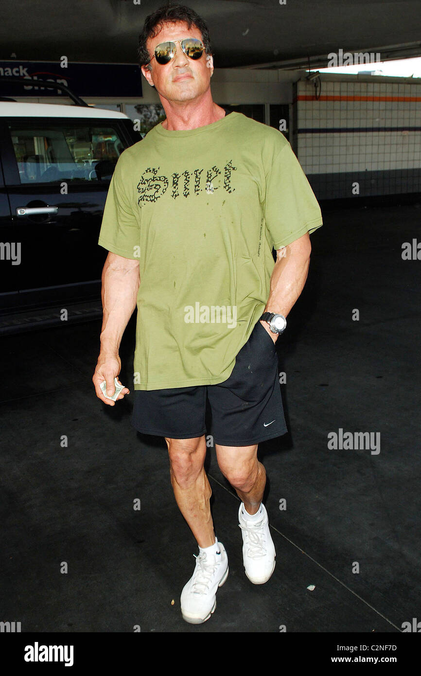 Sylvester Stallone fills up his Ferrari with gas at a 76 gas station in
