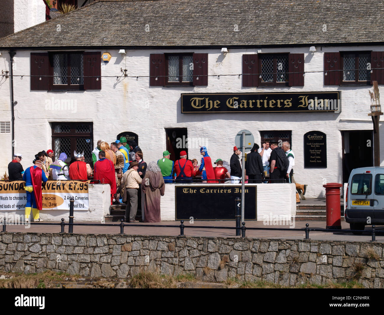 Group in fancy dress outside a pub, Bude, Cornwall, UK Stock Photo Alamy