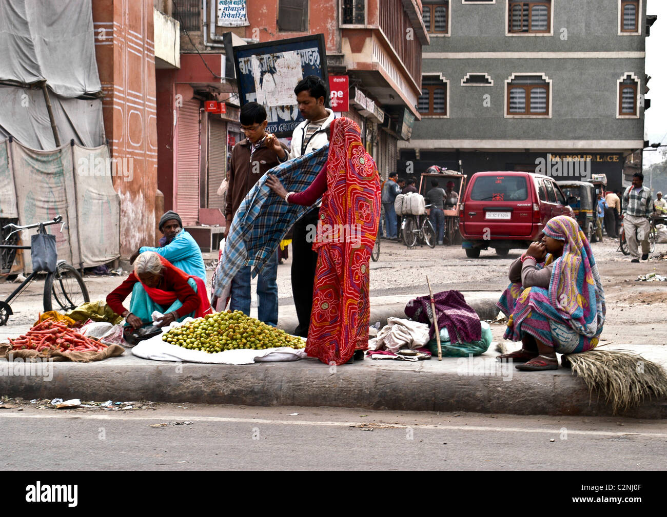 Female vendors selling fresh fruits and vegetables on islands in main