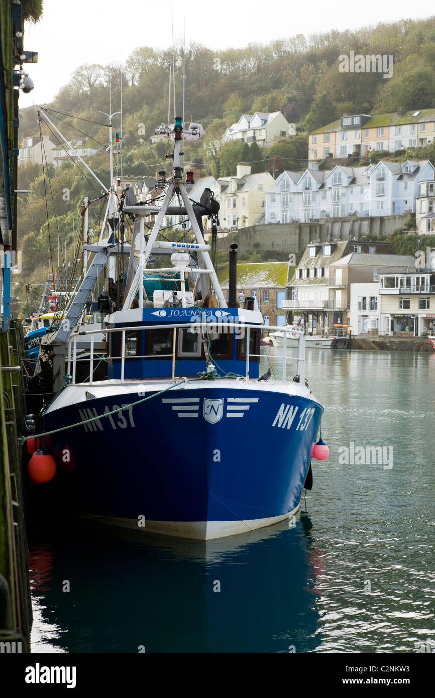 Cornish fishing boat moored at the quay / quayside in the harbour at East Looe in Cornwall. UK. Stock Photo