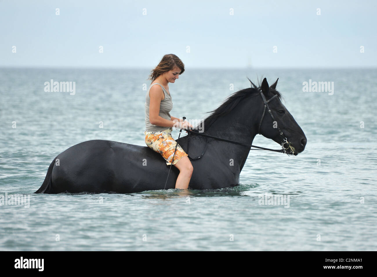 Woman riding horse sea hi-res stock photography and images - Alamy