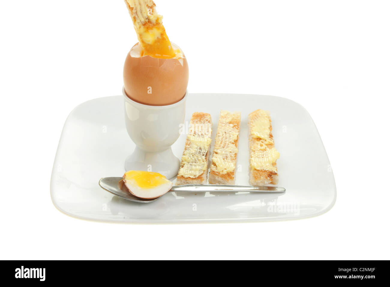 Boiled egg and toast soldiers on a plate isolated against white Stock Photo