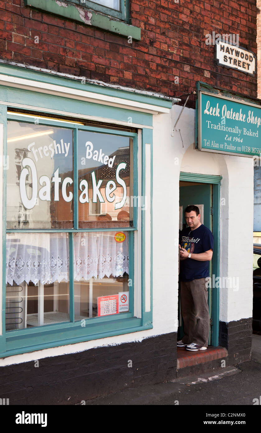 UK, England, Staffordshire, Leek, Haywood Street, man queueing outside oatcake shop Stock Photo