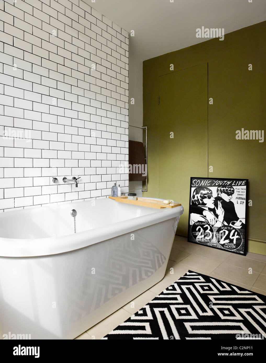 Modern bathroom in Georgian house in Islington, Loondon with white tiled wall and black and white geometric patterned Stock Photo