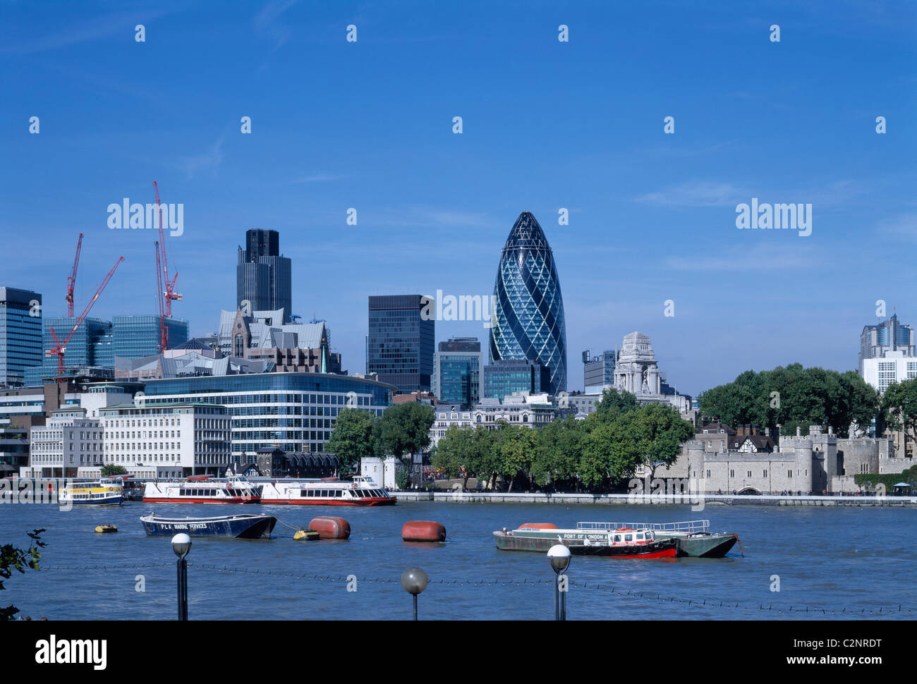Swiss Re Headquarters, 30 St Mary Axe, (The Gherkin) London. Context overview across river Thames. Stock Photo