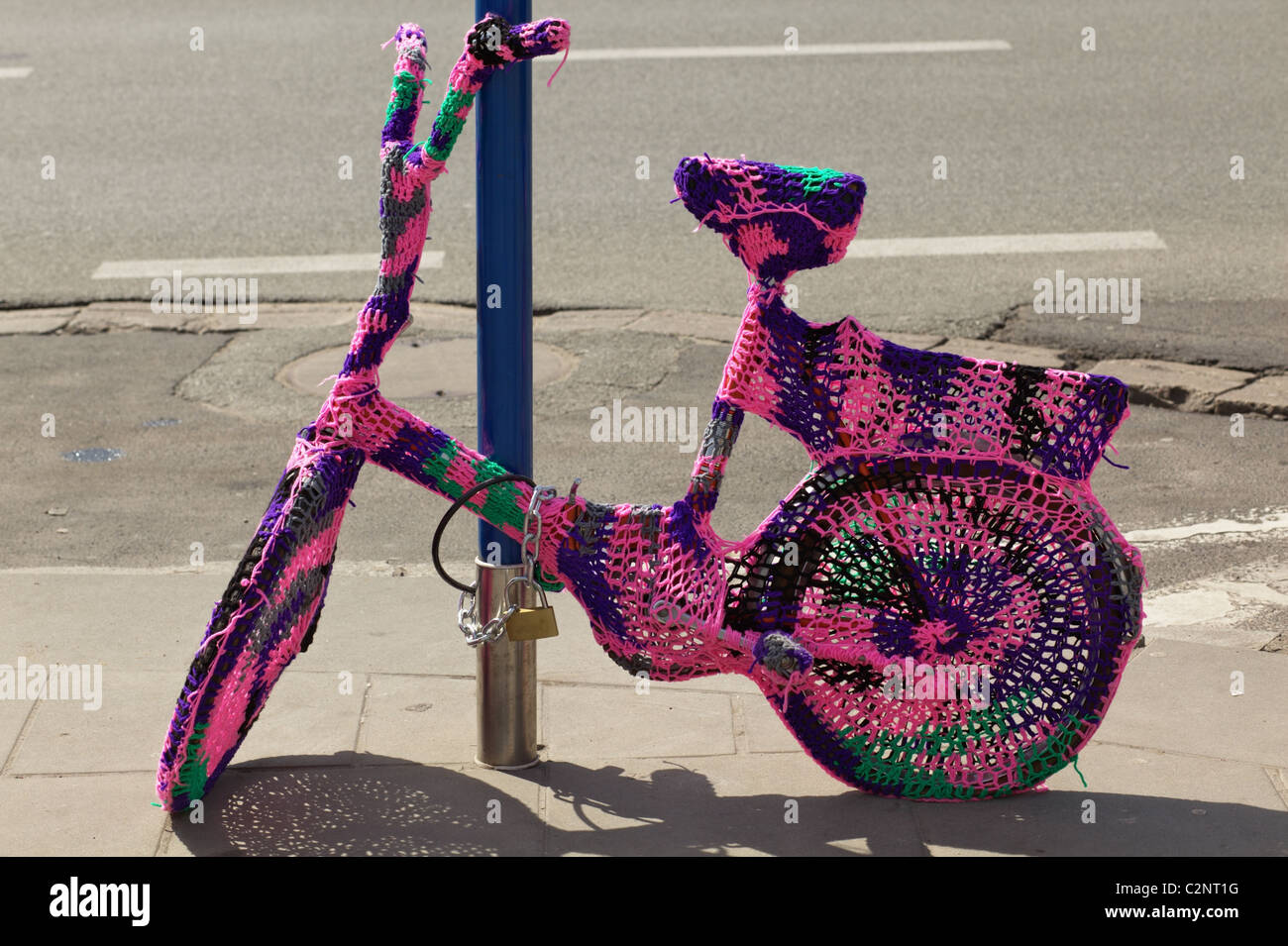 Funny bicycle locked up Stock Photo