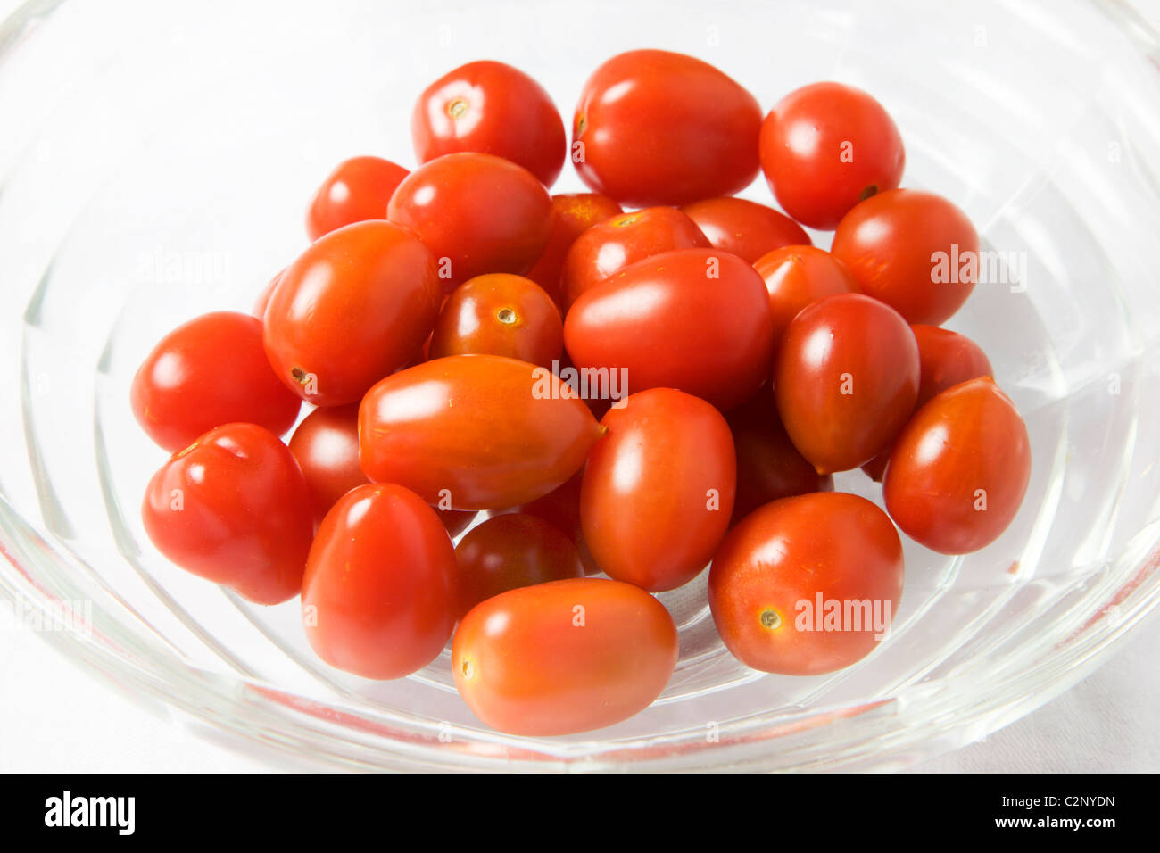Baby Plum Tomatoes in a Glass Bowl Stock Photo Alamy