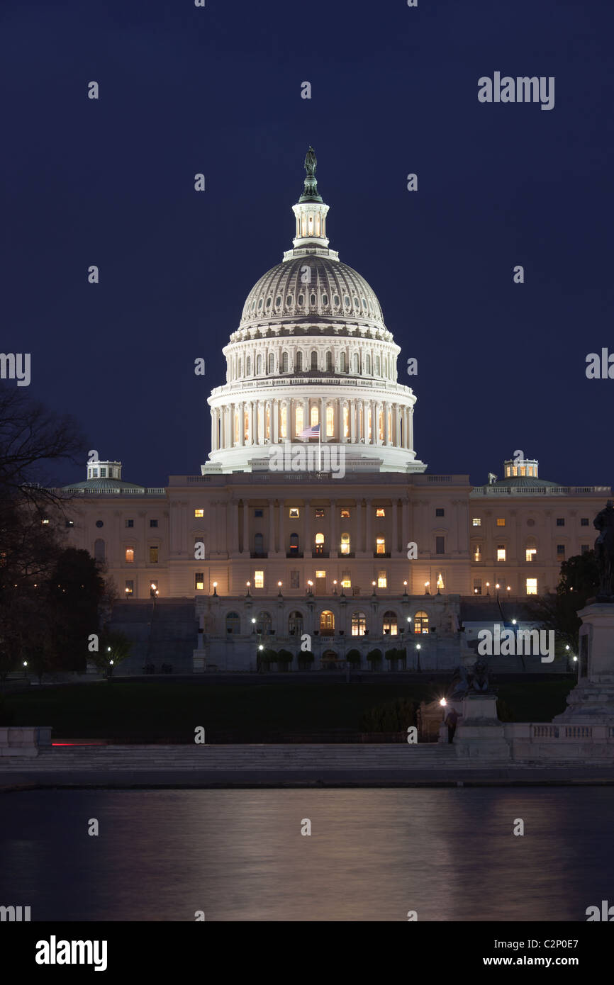 Lights illuminate the US Capitol Building at twilight in Washington, DC. Stock Photo