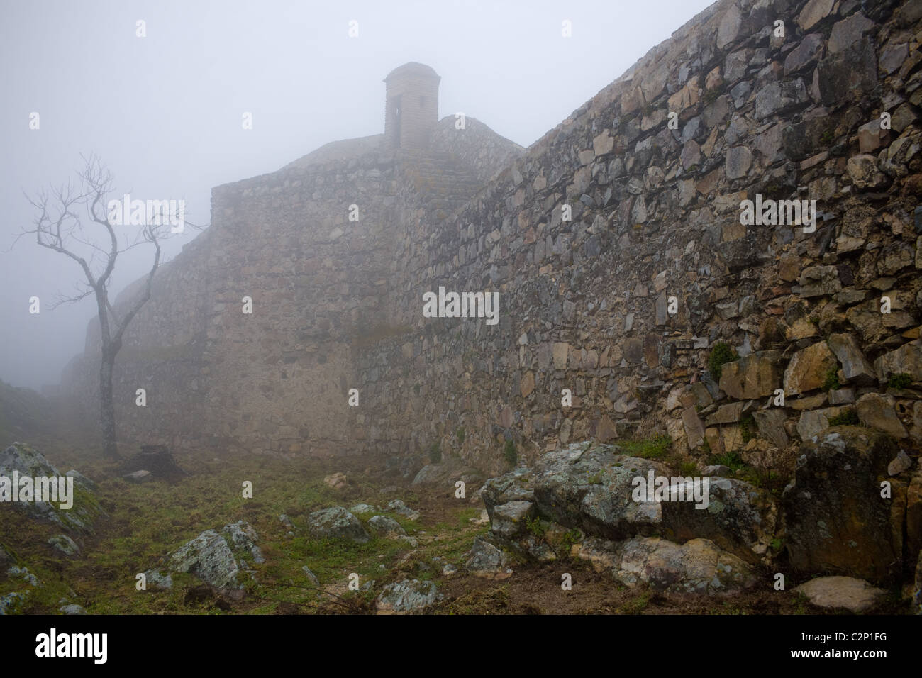 Mist shrouds mountain citadel of Marvao, Portugal Stock Photo