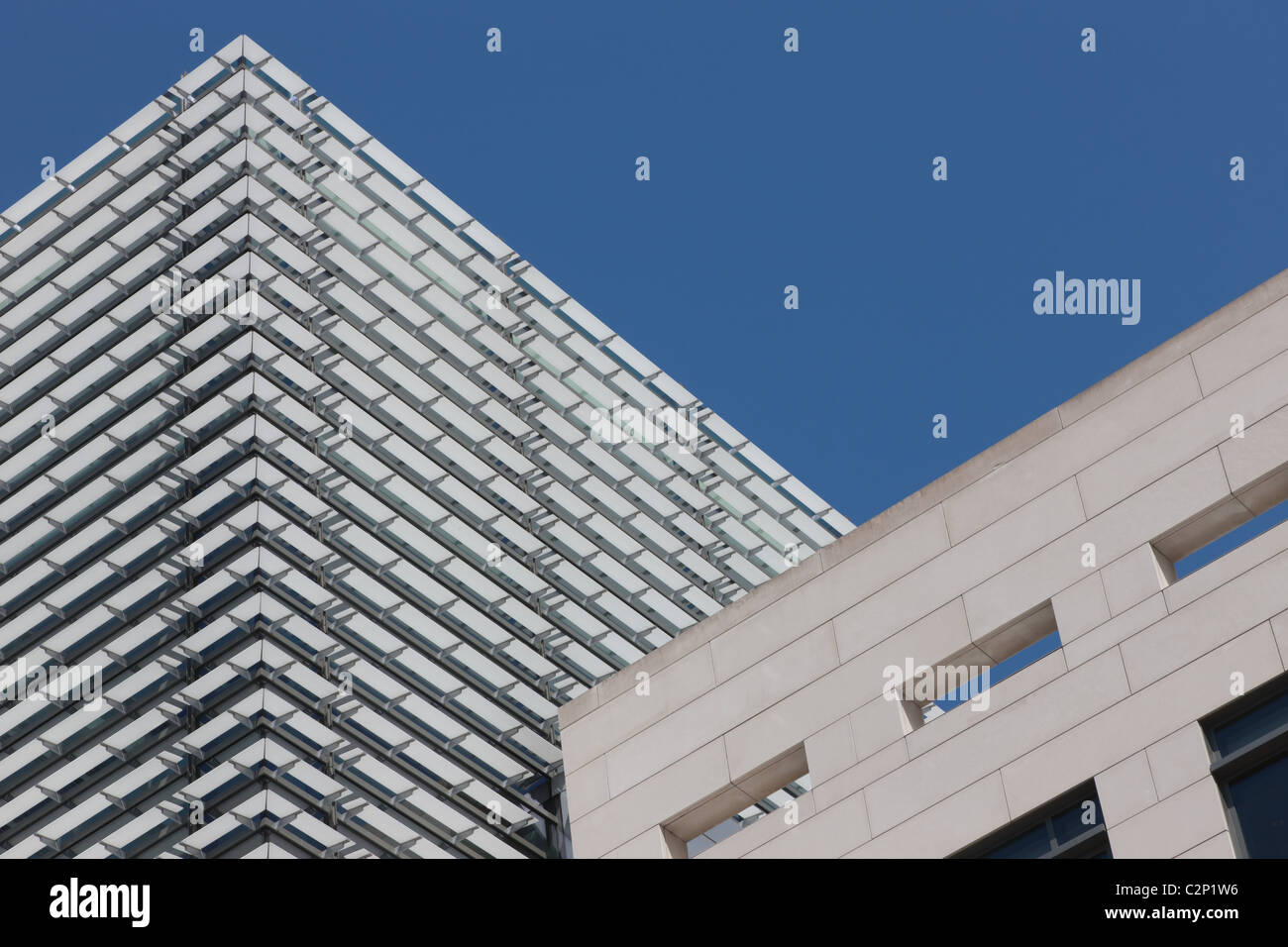 Contrasting facades of the Newseum and an adjacent building in Washington, DC. Stock Photo