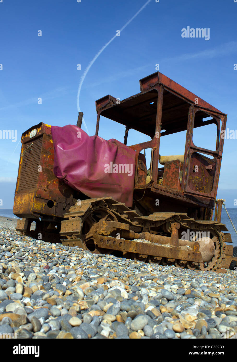 A fisherman's tractor on the shingle beach at Weybourne Stock Photo