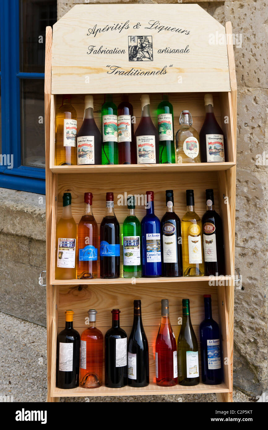 Local aperitifs and liqueurs outsid a shop in the village centre, Coulon, Marais Poitevin, Poitou Charentes, France Stock Photo