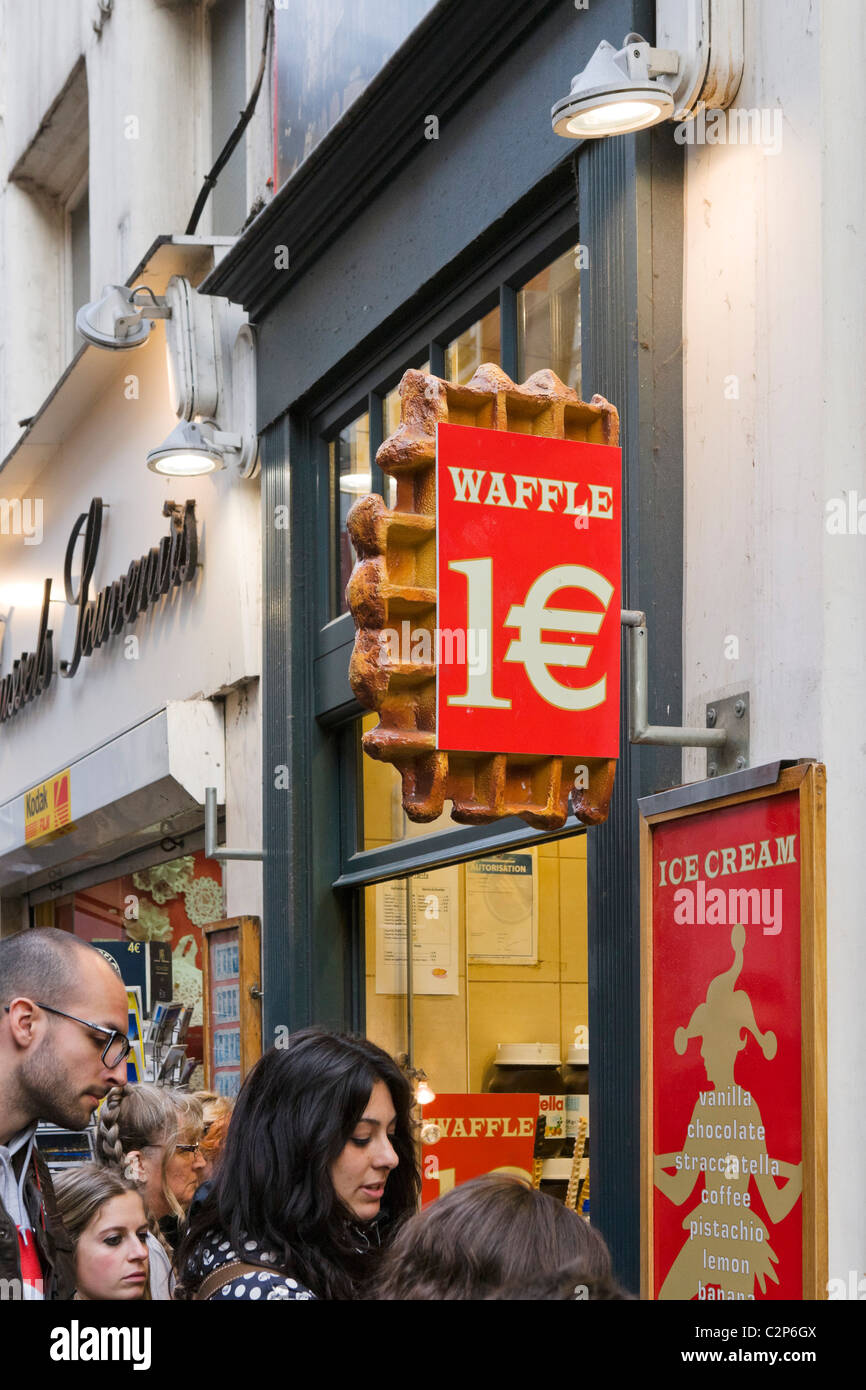 People outside a waffle stall in the city centre, Brussels, Belgium Stock Photo