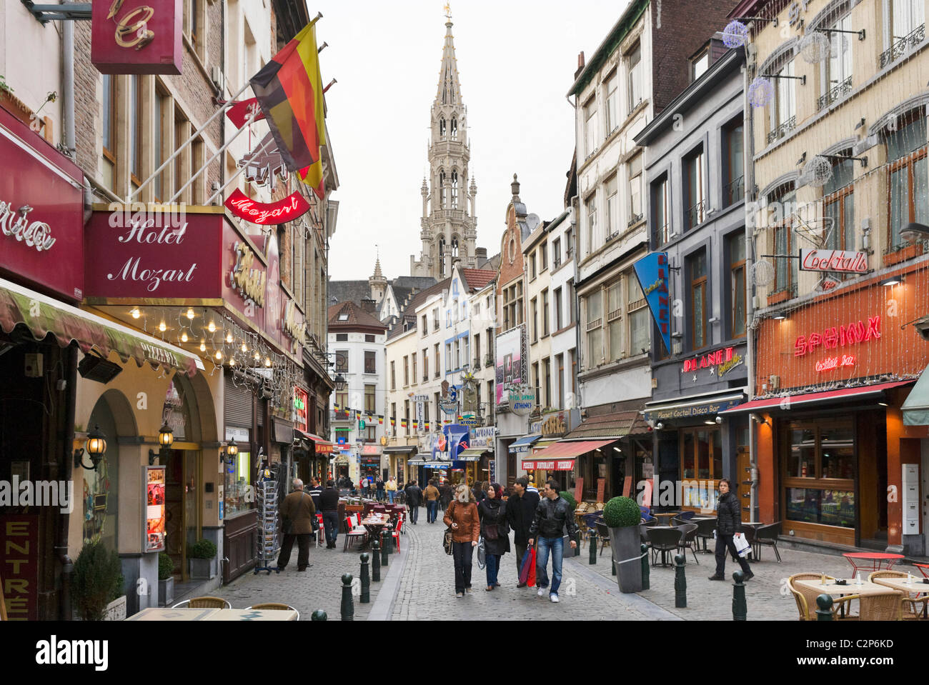 Bars and restaurants on the Rue du Marche aux fromages with the spire of  the Hotel de Ville behind, Brussels, Belgium Stock Photo - Alamy