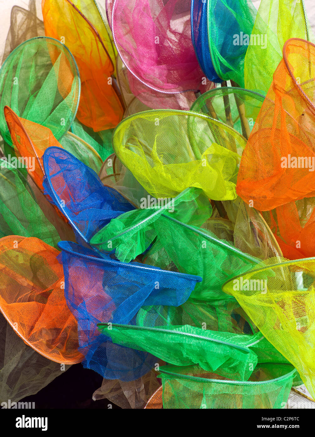 Multicoloured childrens' fishing nets, Clovelly, Cornwall Stock Photo