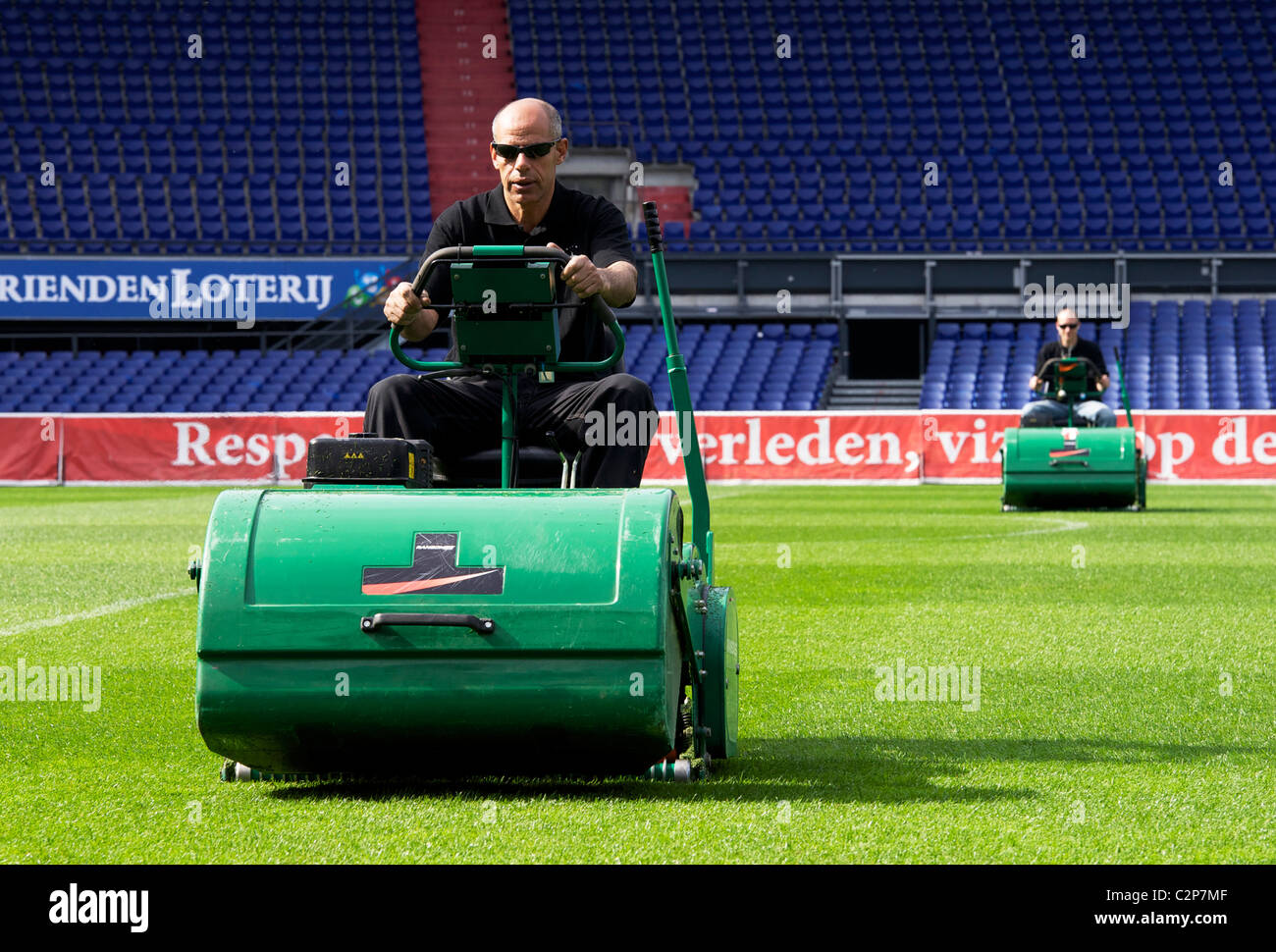HOLLAND-ROTTERDAM-Groundsman at work at football stadium 'De Kuip', home of Feyenoord. The pitch is the best in Holland. Stock Photo