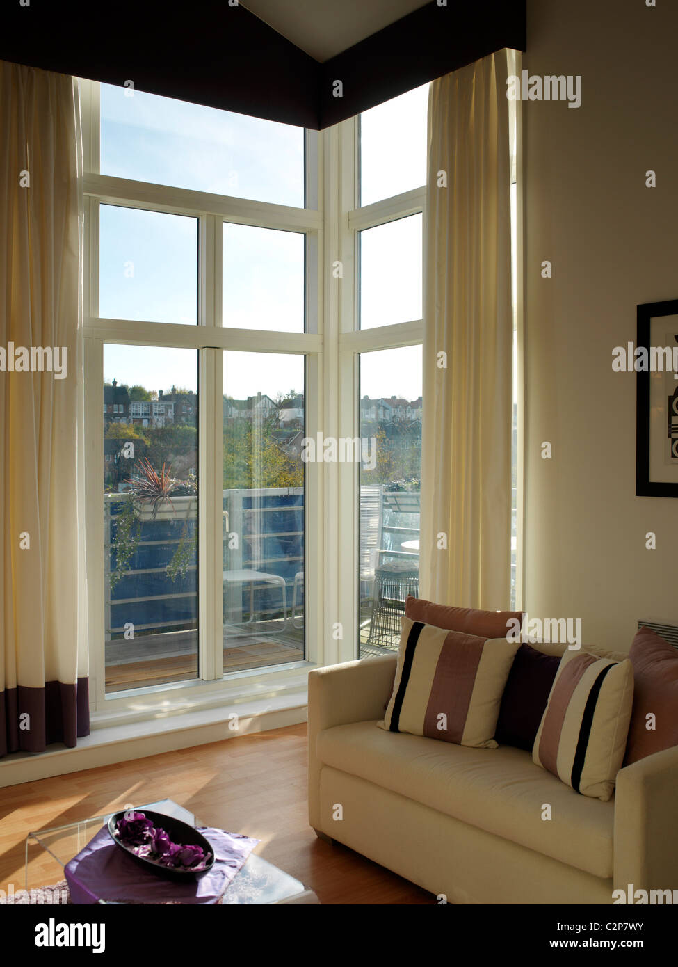 Delta Apartments, Maidstone corner windows and sofa Stock Photo Alamy