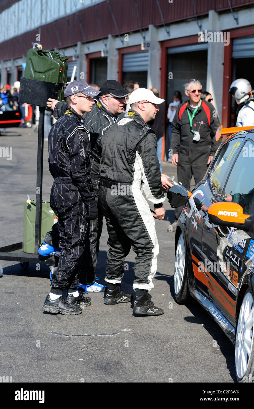 Stock photo of cars being refulled in the paddock at the circuit val de vienne. Stock Photo