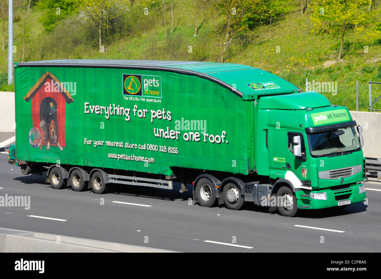 Aerodynamically shaped trailer and lorry delivering goods for Pets at Home Stock Photo