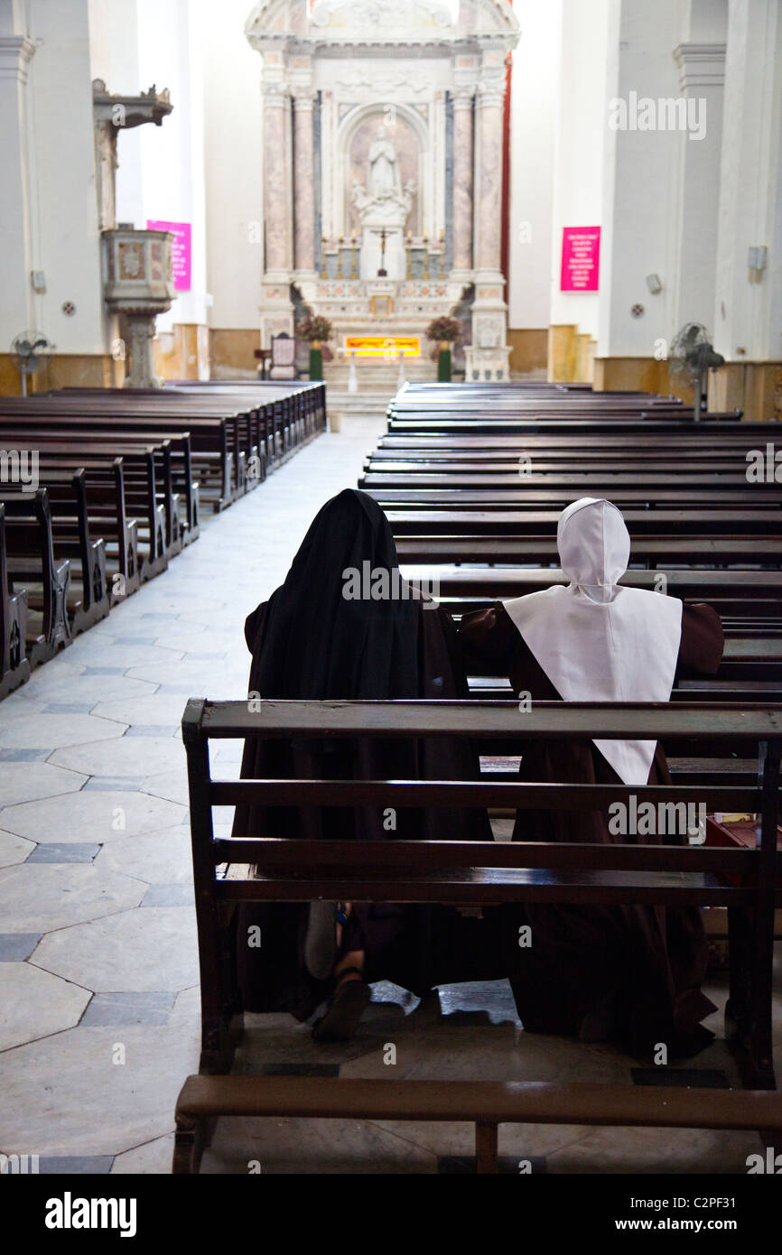 Nuns inside Cathedral de San Pedro Claver, Cartagena, Colombia Stock Photo