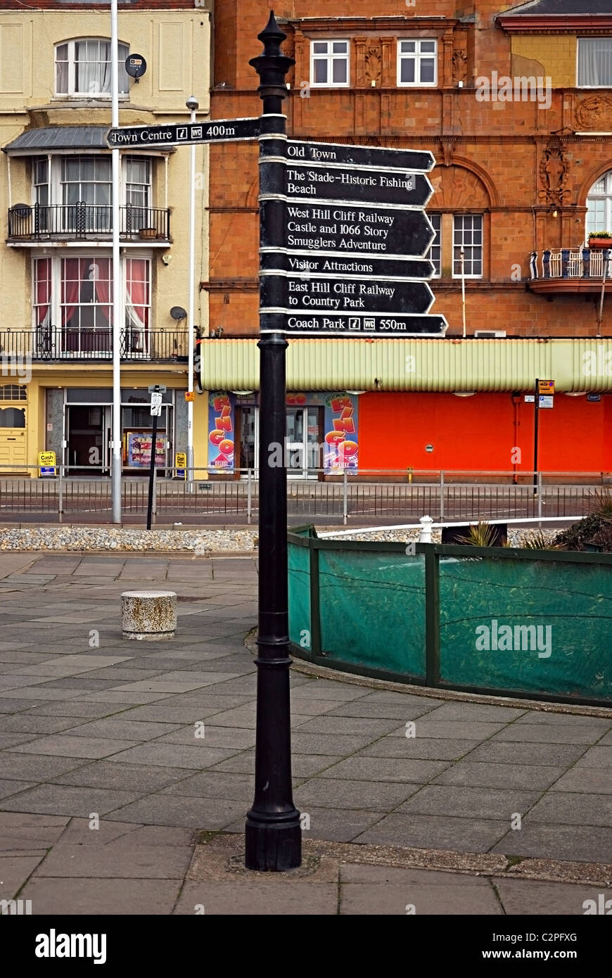 Signpost pointing to Hastings Attractions Stock Photo