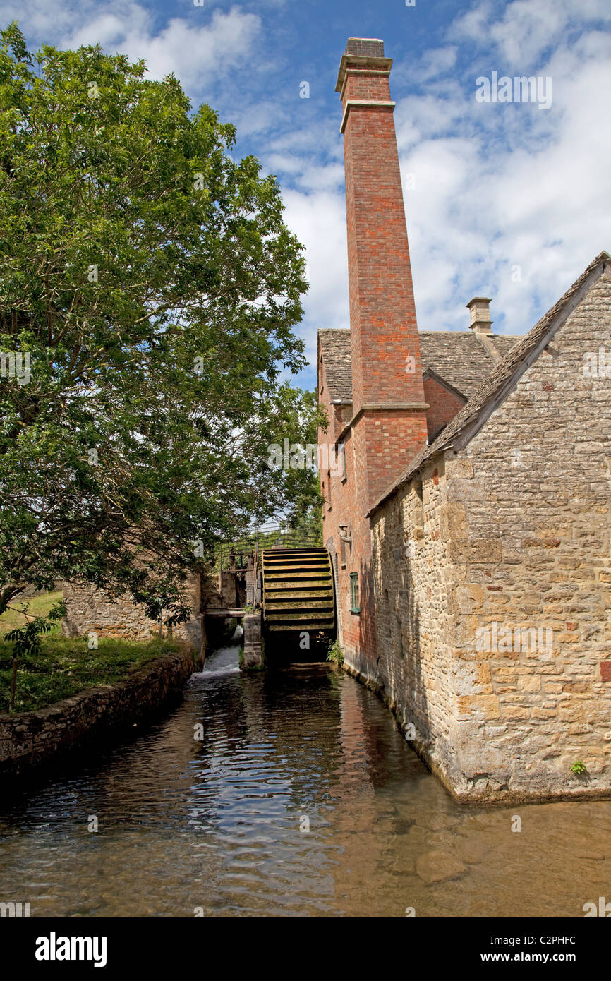 Old water mill wheel Lower Slaughter Cotswolds UK Stock Photo