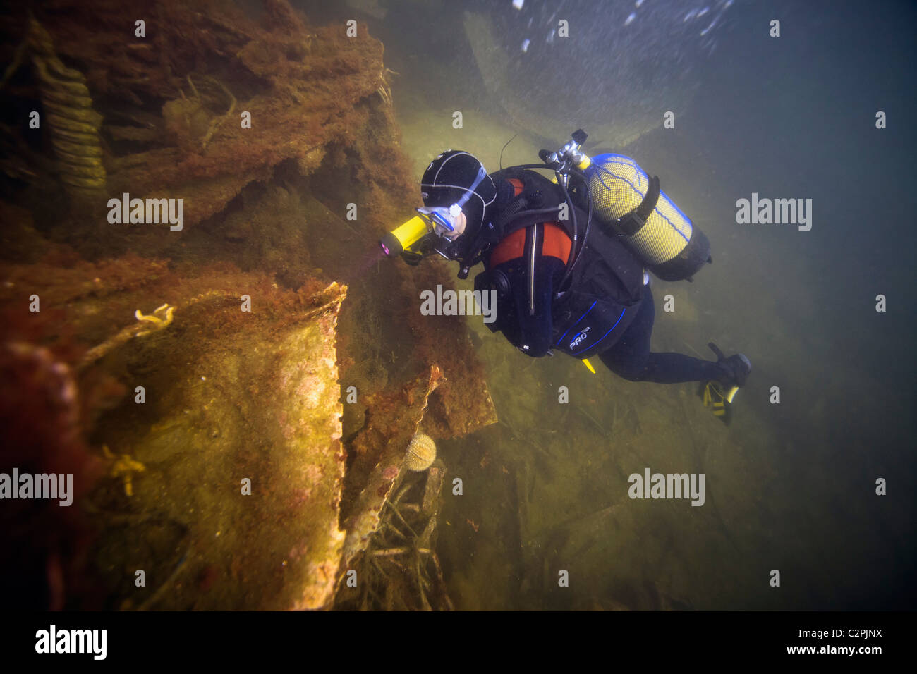 A diver inspects the wreckage of the German destroyer, F2 in Scapa Flow, Orkney Stock Photo