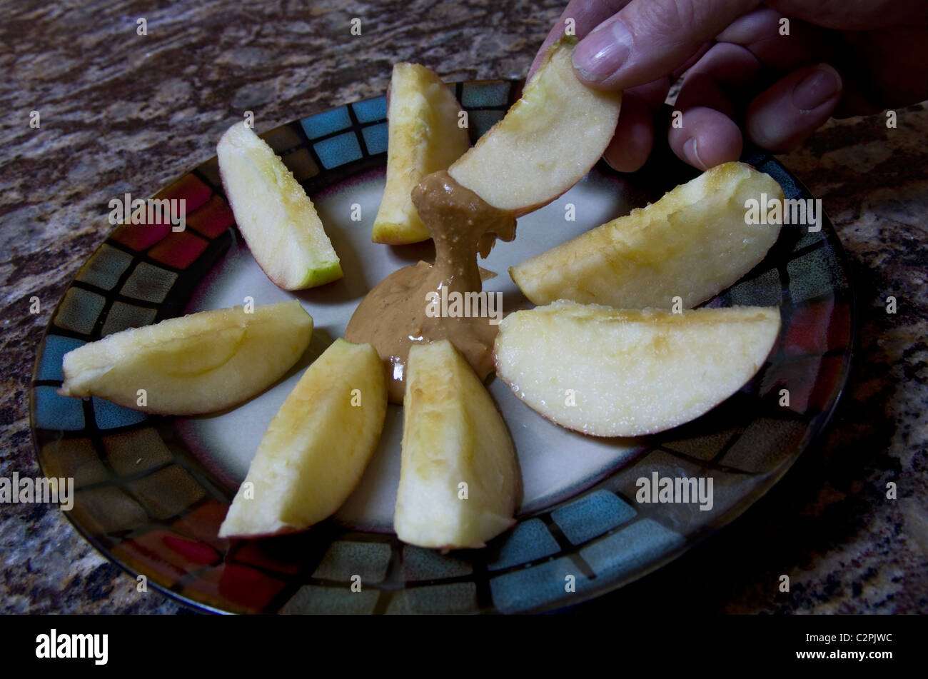 Sliced apple with peanut butter Stock Photo