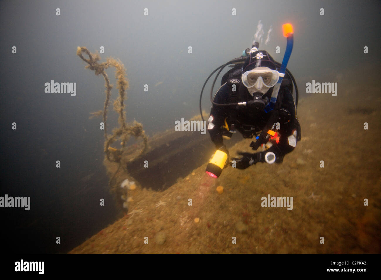 A female diver on the wreck of the SMS Brummer in Scapa Flow, Orkney Stock Photo