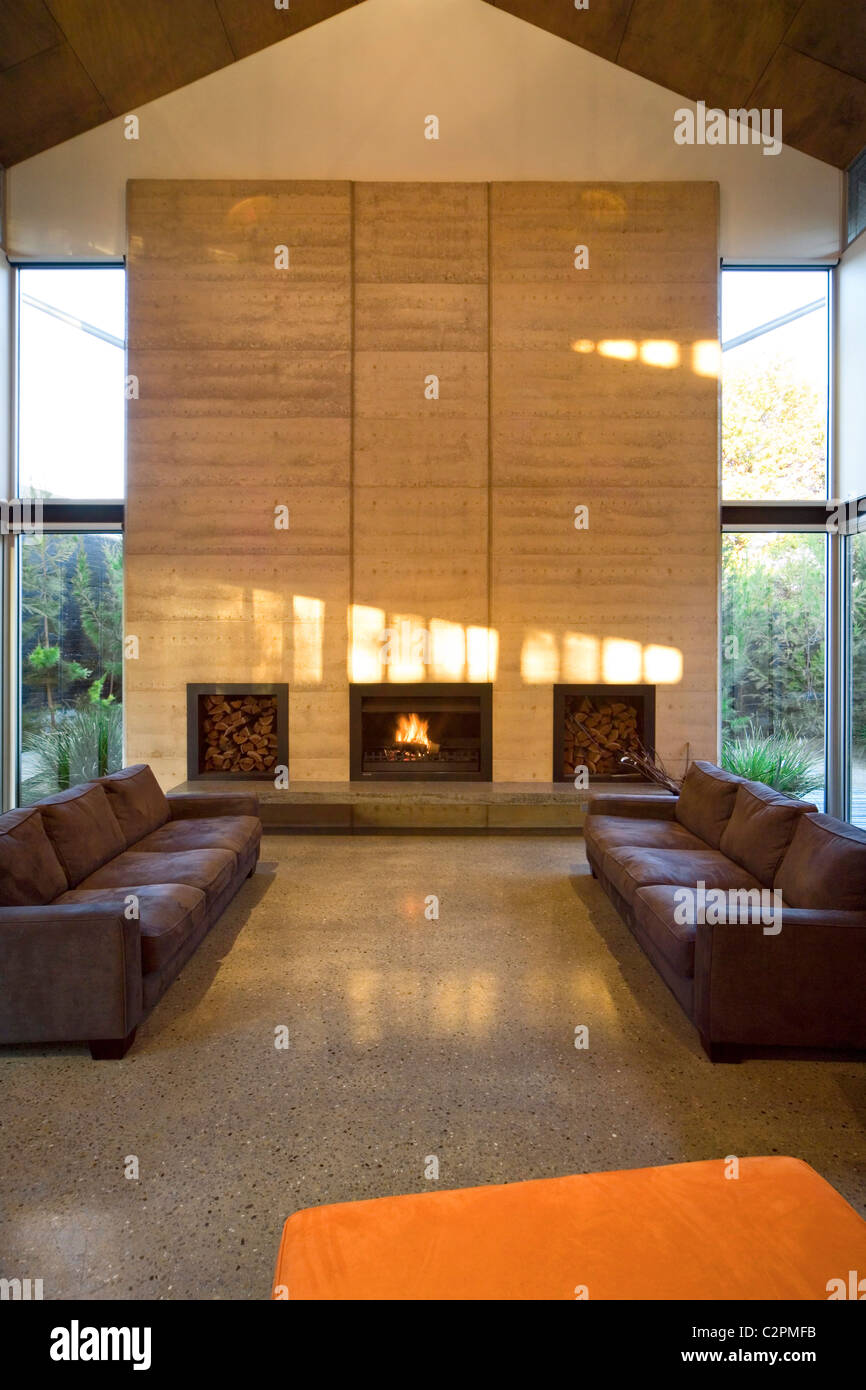 Caston House, Melbourne Australia. double height living room with fireplace Stock Photo