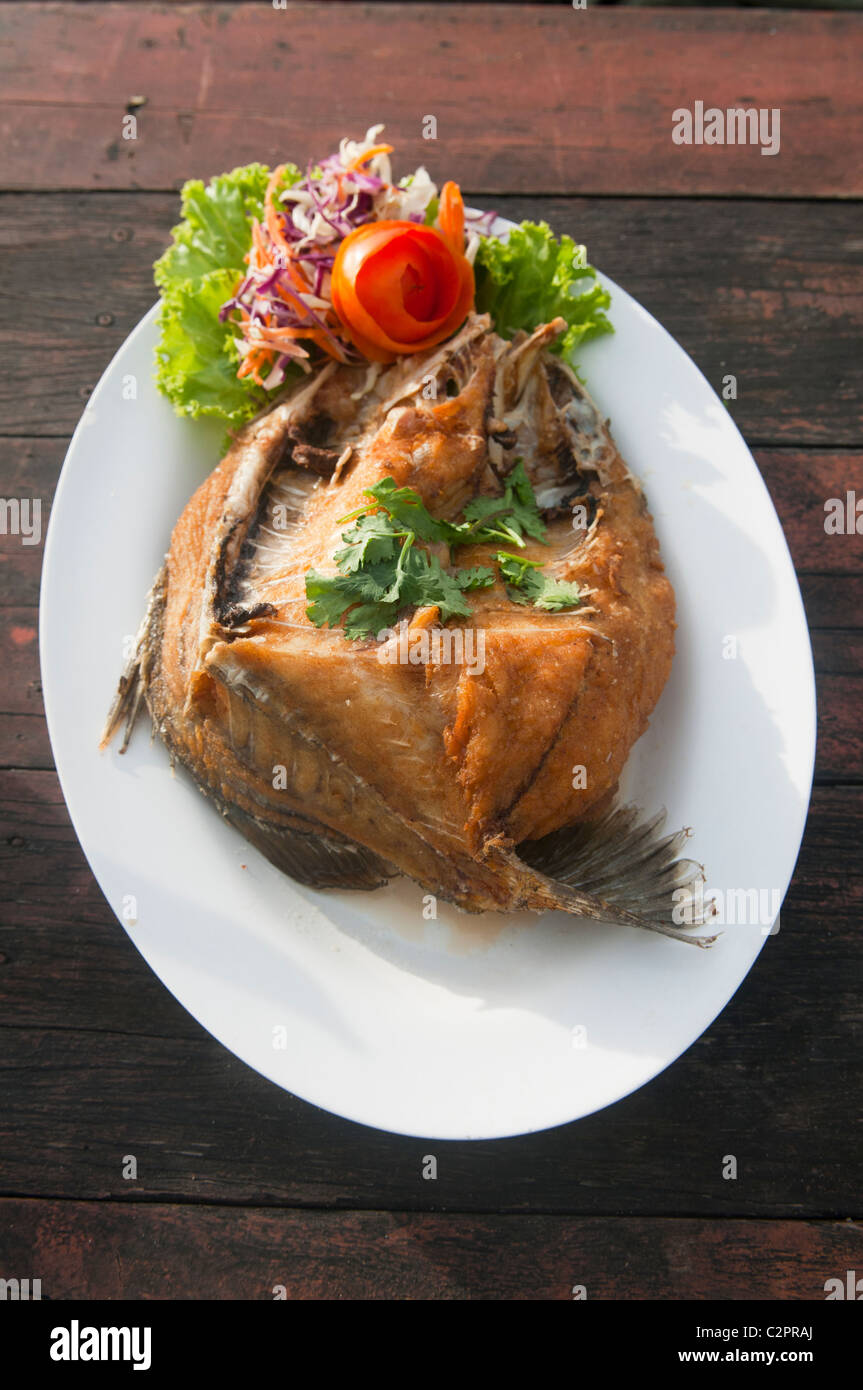 fried sea bass at a seafood restaurant near Pattaya, Thailand Stock
