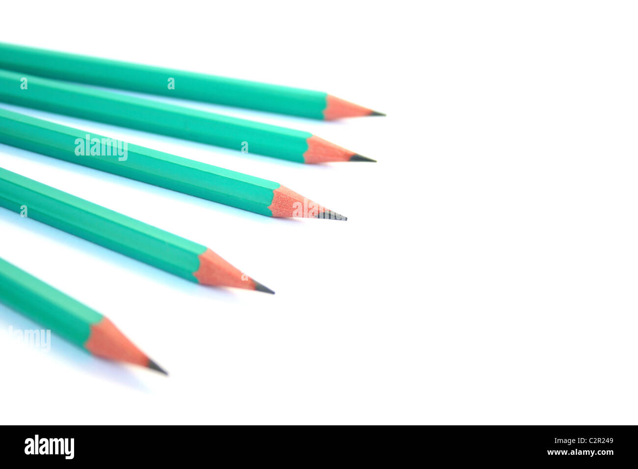 Five pencils on white background. Stock Photo
