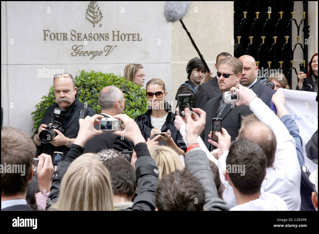Dion Sign Celine Dion signs autographs outside the George V Hotel Paris, France ...