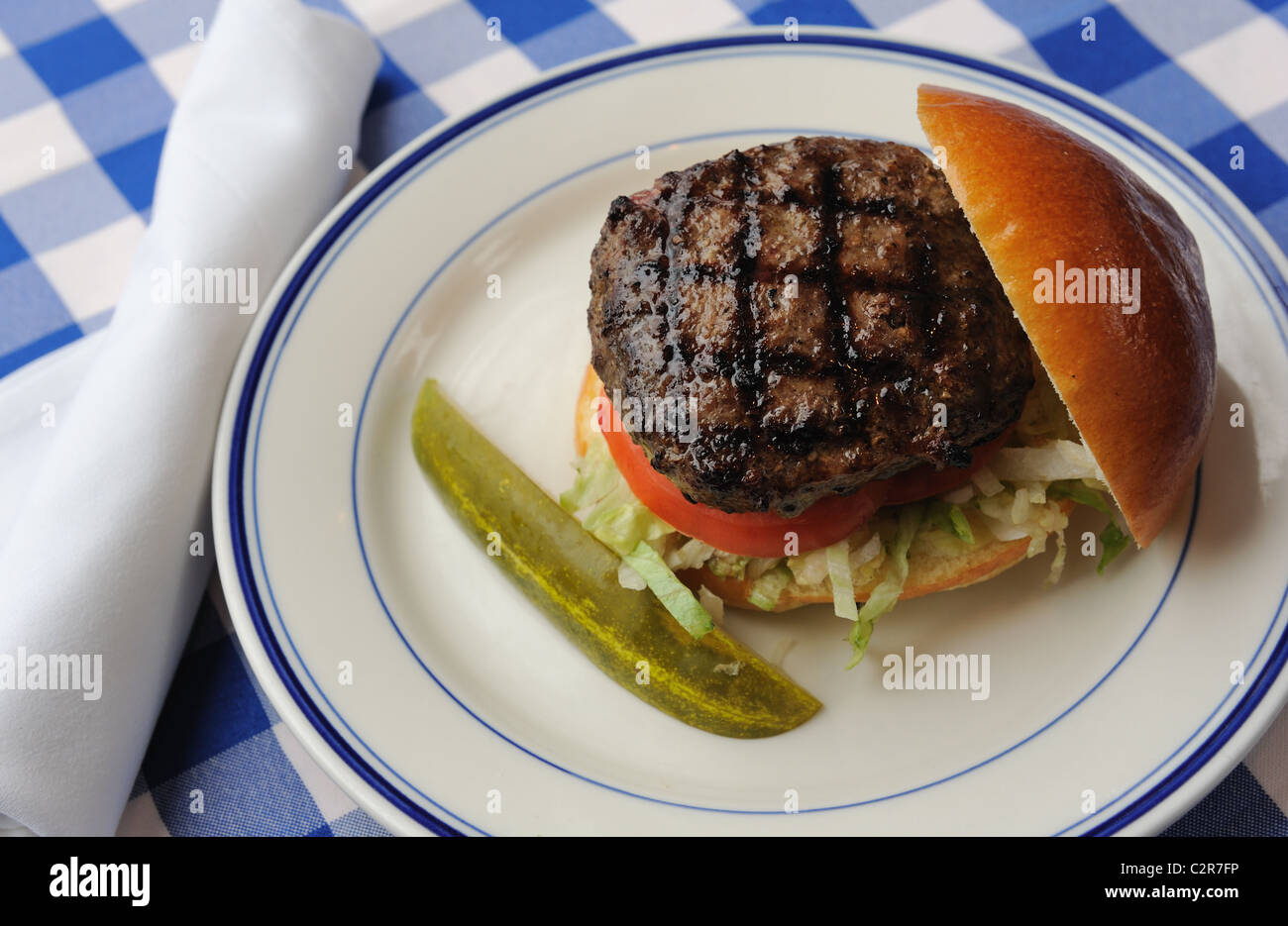 Hamburger with a pickle Stock Photo Alamy