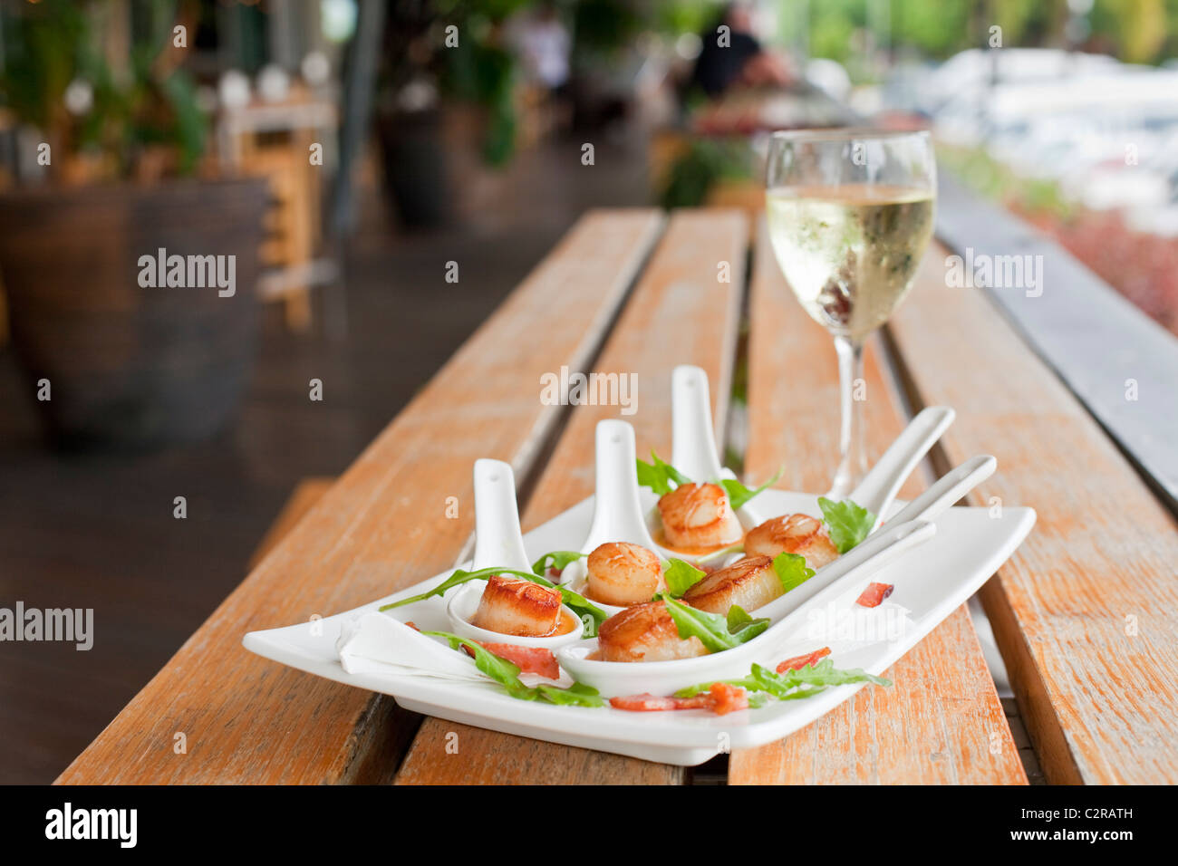 Seared scallops in Thai red curry sauce at Bellavista at the Marina