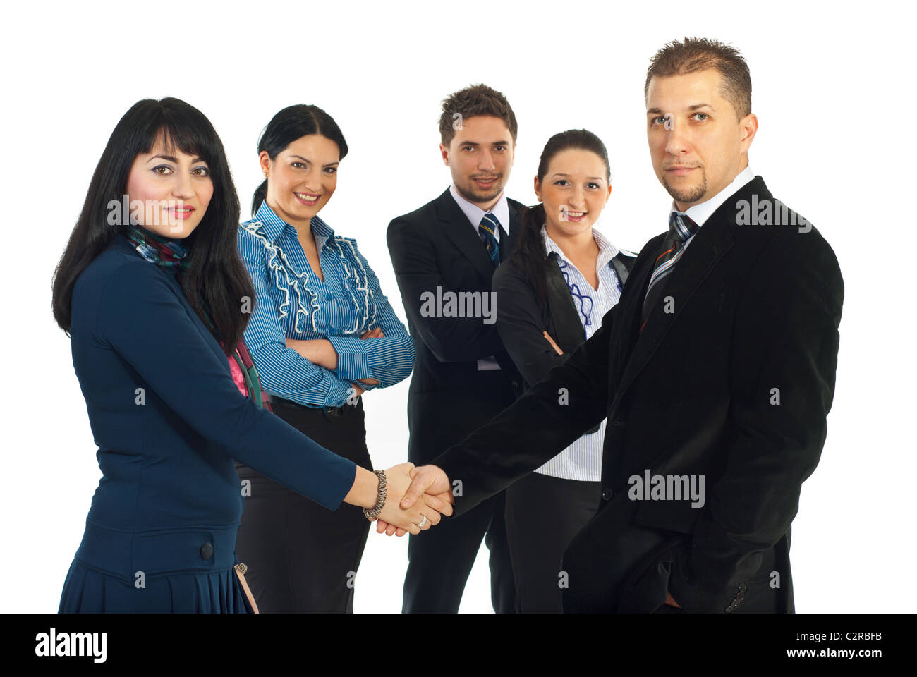Business man and woman gives handshake in front of their team isolated ...