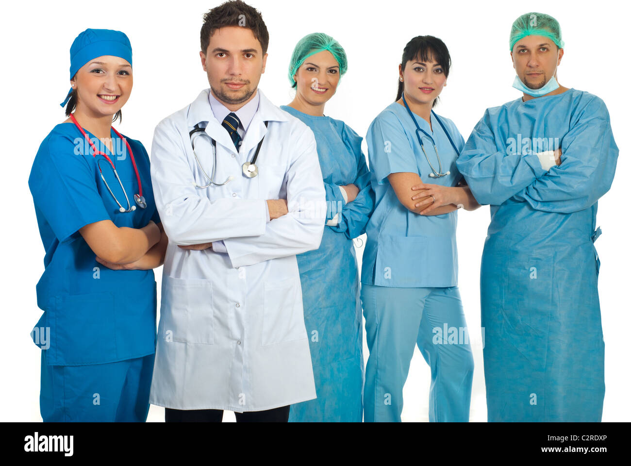 Two teams of young adults doctors and mid adults doctors standing with arms folded isolated on white background Stock Photo