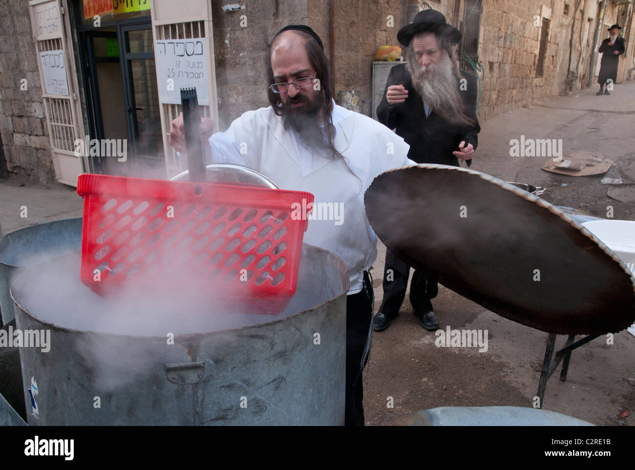 purification of cooking pots for Jewish Passover. Mea Shearim orthodox neighborhood. Jerusalem Stock Photo
